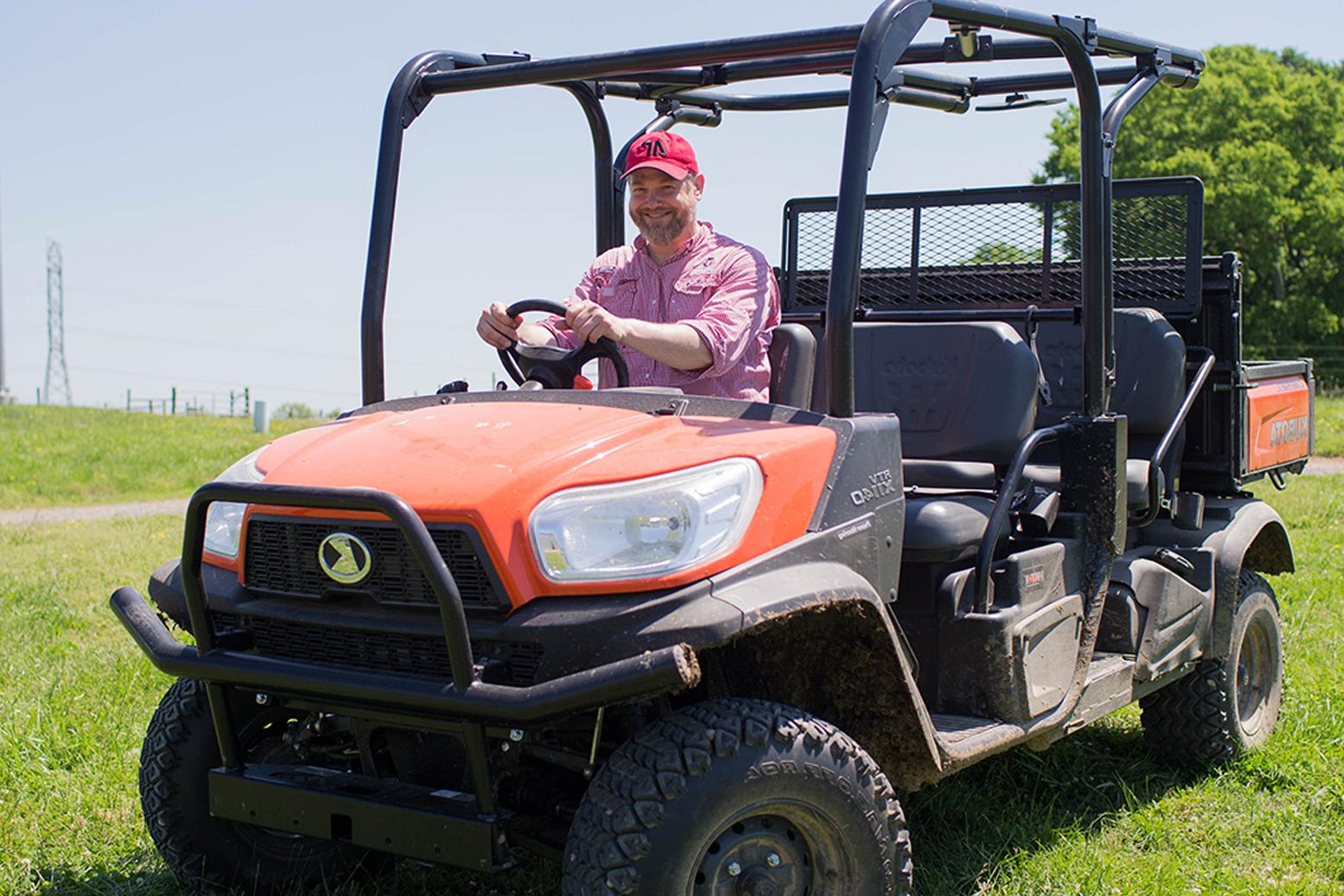 Donald Sudbrink poses in Kubota