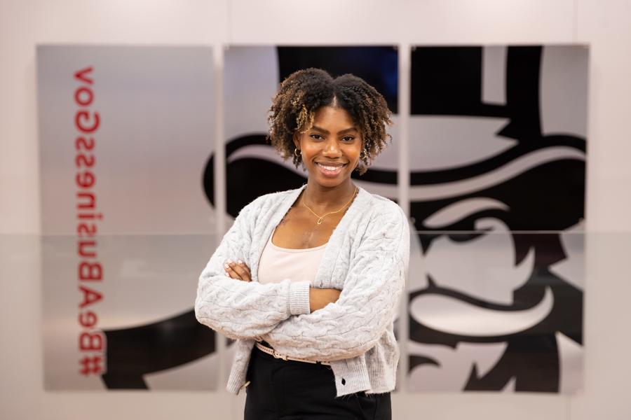 Student standing with arms crossed