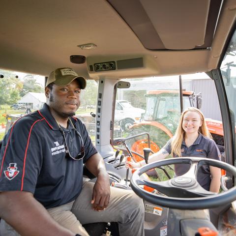 Student sitting in tractor